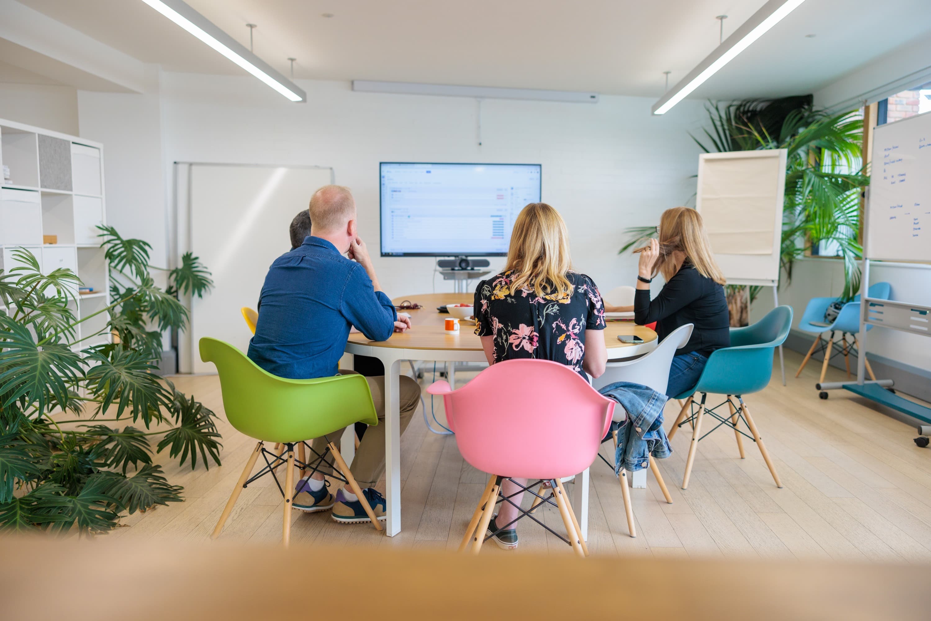 The Unified team, including our Shopify Plus developers, discussing solutions in our offices in Richmond, London.